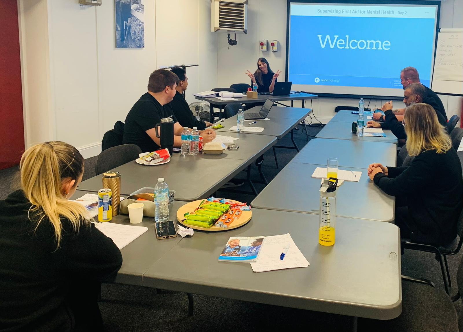 Lynsey delivering a mental wellbeing workshop to a group of participants