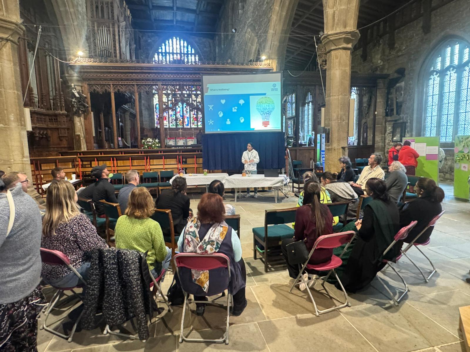Participants seated for a wellbeing workshop in a community venue